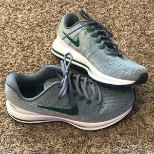 Green and gray team issued Nike Running shoes